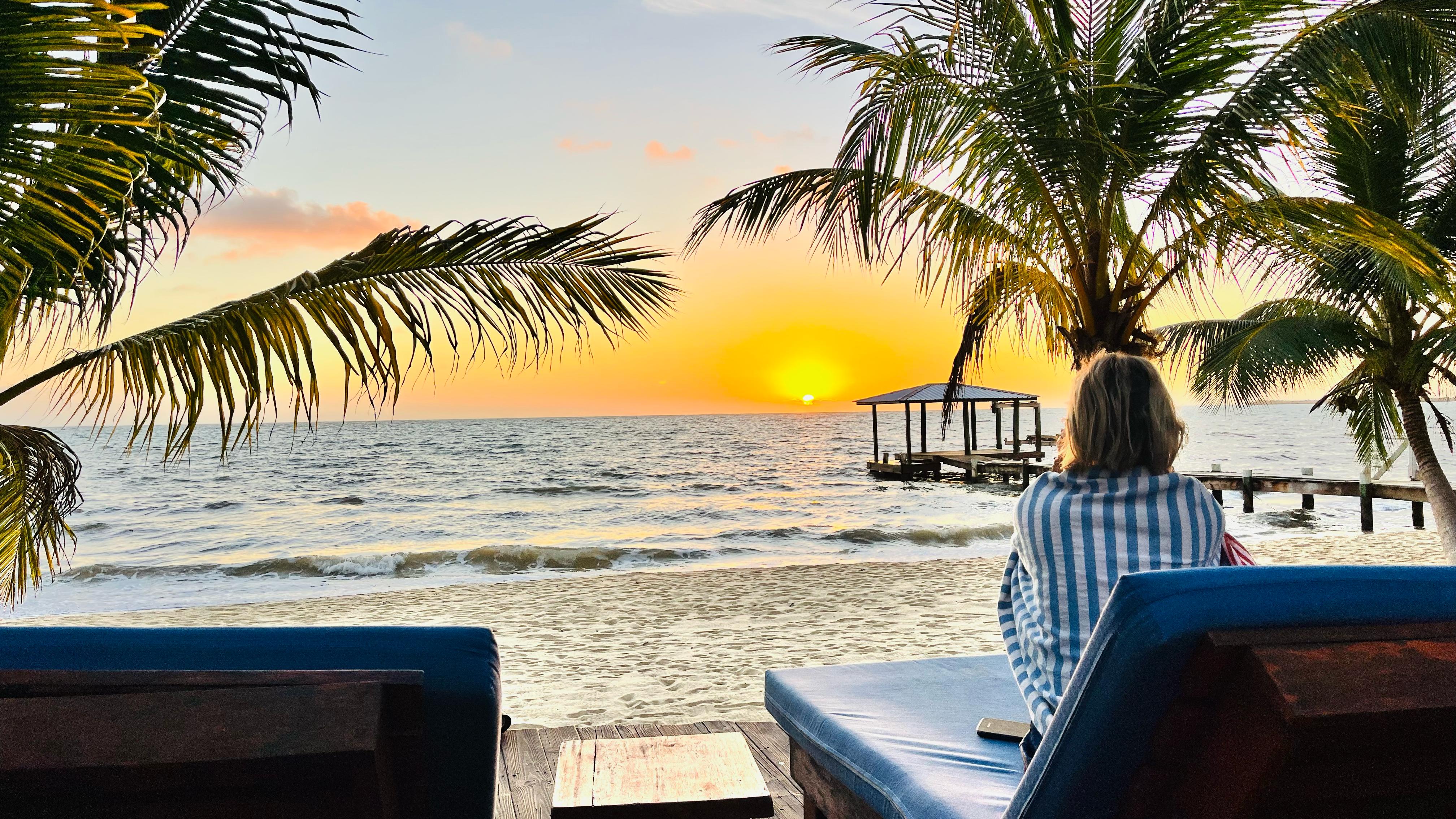 Sunset from Coral Cove Inn's beach in Maya Beach, Belize