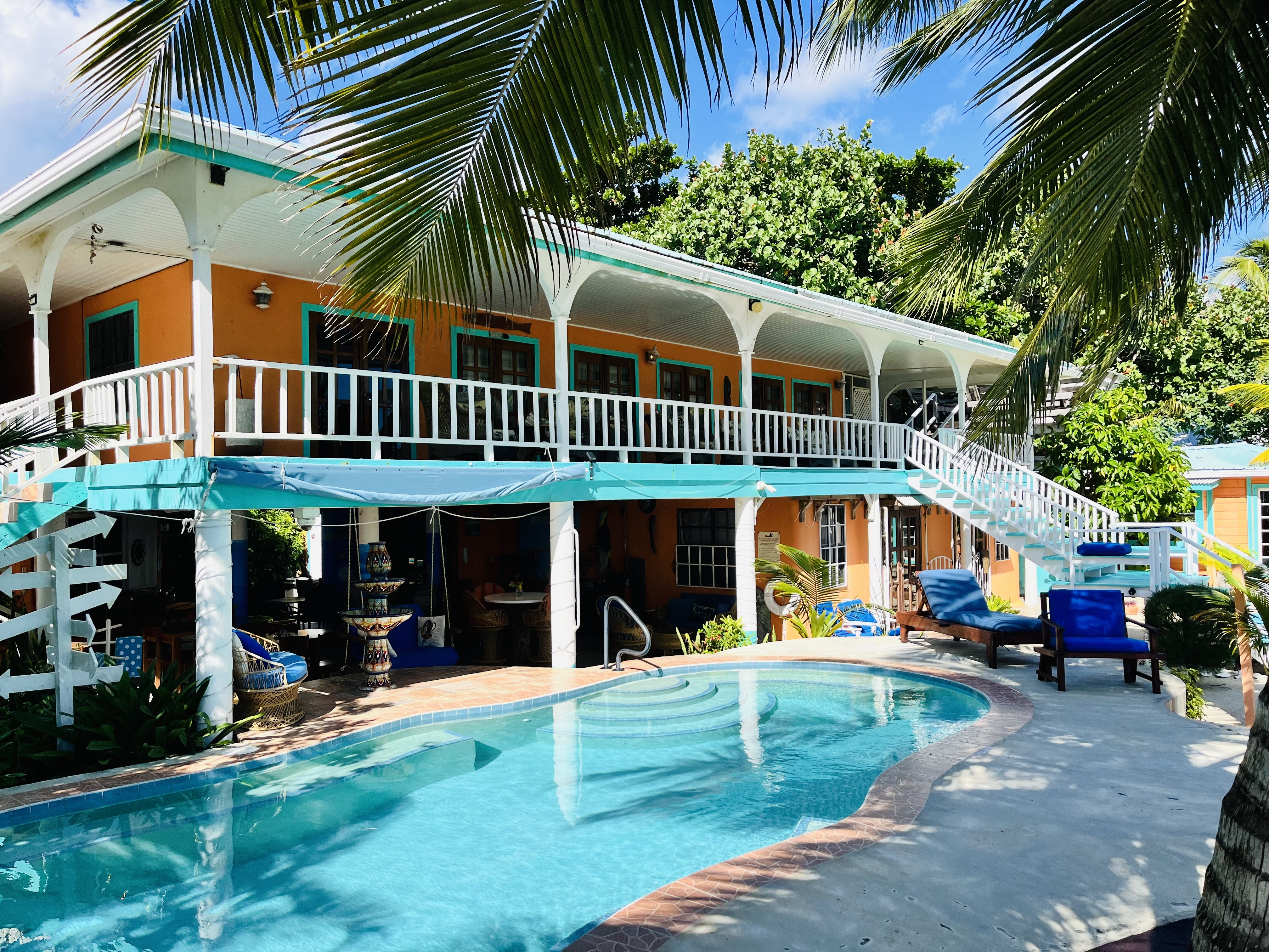 Colorful Coral Cove Inn buildings around the swimming pool